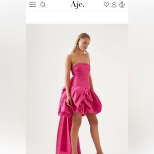 Pink Aje Piacere strapless bow-detailed satin mini dress.